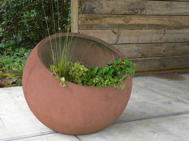 De Tijdloze Elegantie en Robuustheid van Betonnen Plantenbakken Buiten